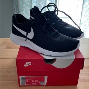 Nike Black and White Nike Tanjun Sneakers size 7 youth